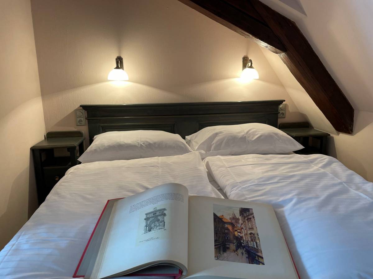 Open book on double bed
